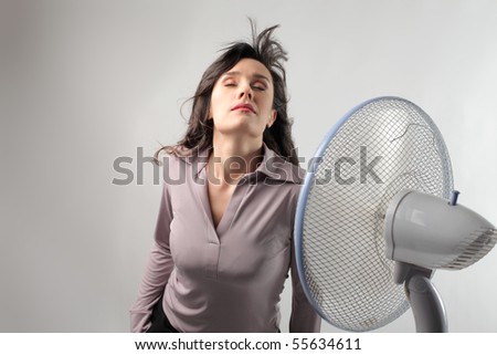 Woman standing in front of a ventilator