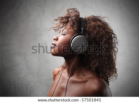 young black woman listen music