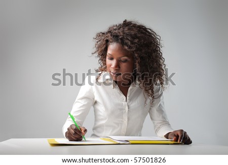 young black woman writing