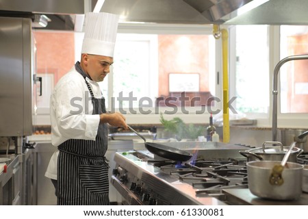 Cook preparing food in a restaurant kitchen