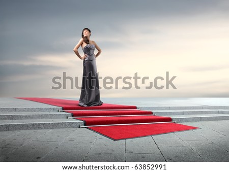 Beautiful elegant woman on a red carpet
