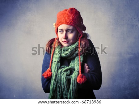 Woman wearing winter clothes feeling cold
