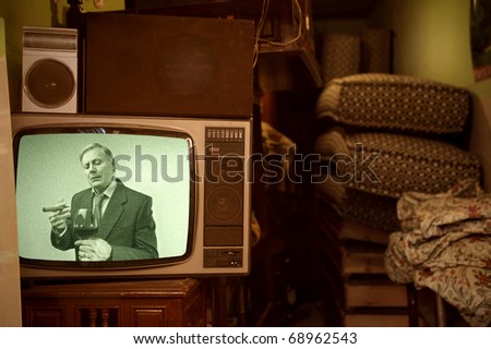 Old television showing a senior gentleman