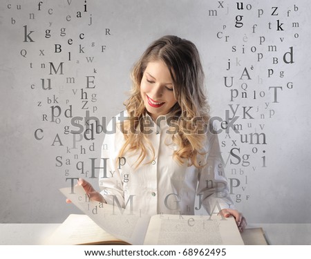 Smiling woman reading a book with letters flying away from it