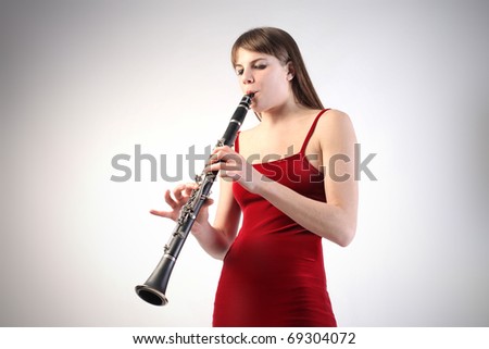Young woman playing the clarinet