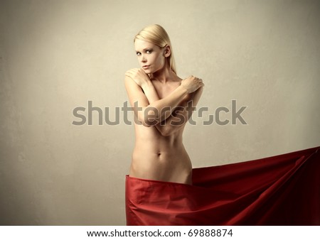 Beautiful woman with a red tissue over her hips
