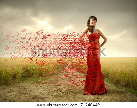 Beautiful woman in red dress with alphabet letters flying away from it