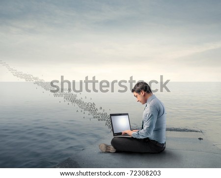 Businessman on a wharf using a laptop and numbers flying away from it