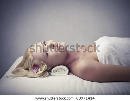 Beautiful woman lying on a couch during a beauty treatment