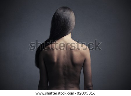 Rear view of a beautiful woman with long straight hair
