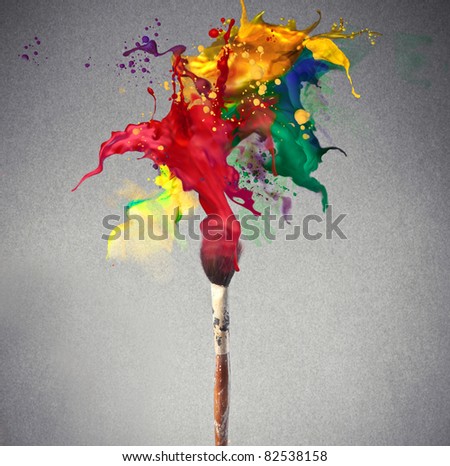 Brush full of colored paint - stock photo