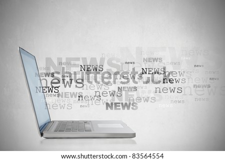 Laptop with the word news coming out of the screen Laptop with the word news coming out of the screen