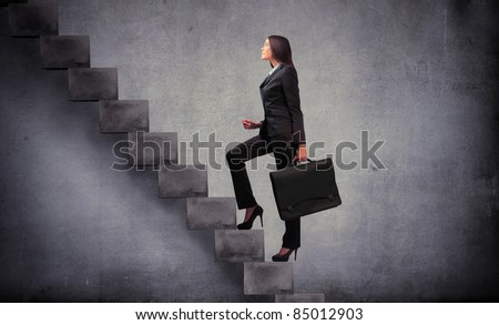 Businesswoman stepping up a stairway