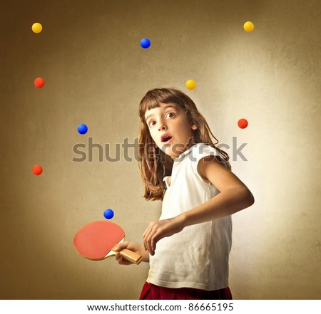 Little girl playing ping pong with many balls