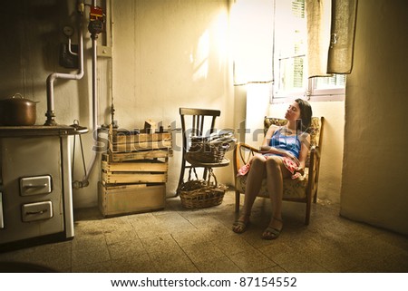 Young woman sleeping in an old house