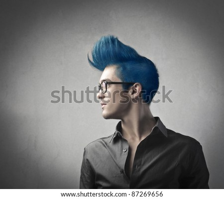 Profile of a handsome man with blue upright hair