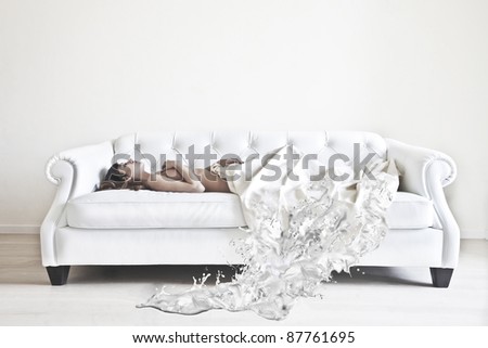 Beautiful woman lying down on a sofa