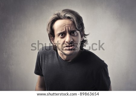 Man with scared and doubtful expression
