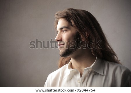 Profile of a young man with long hair