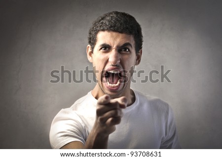 Angry man pointing his finger at someone