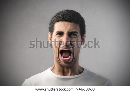 Angry african man screaming