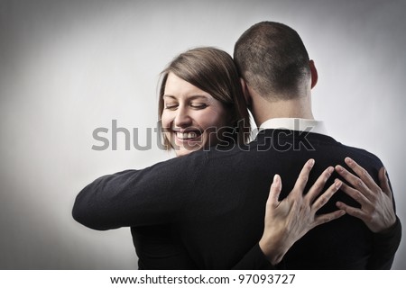 Smiling woman hugging her husband