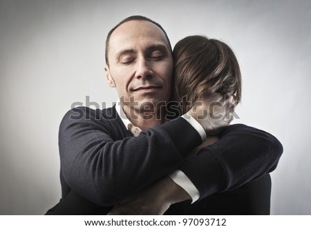 Young man hugging his wife
