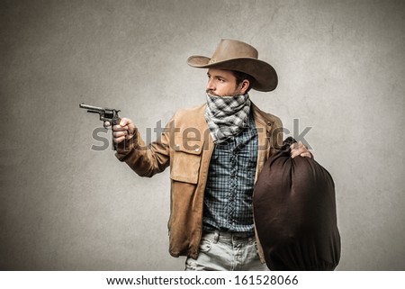 bandit with gun and sack of stolen money