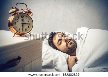 young man sleeping in the bed