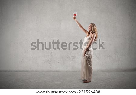 Happy woman drinking a glass of wine