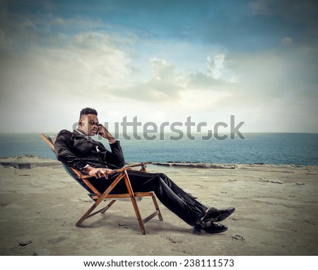 Relaxed businessman at the seaside