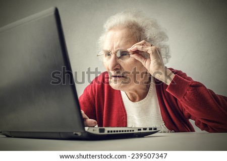Confused grandmother using a pc