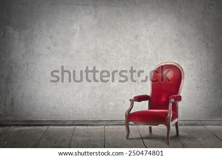 Red chair in an empty room