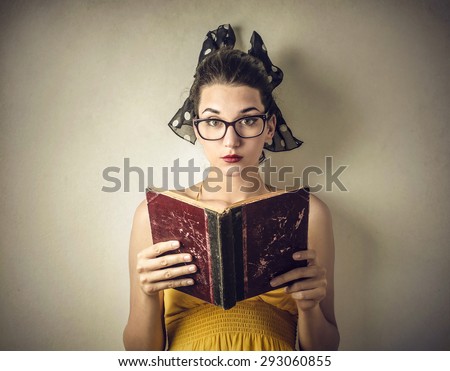 Woman reading an old book
