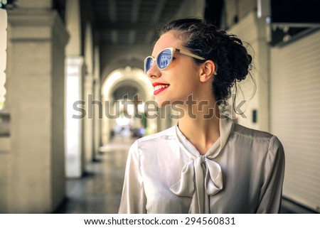 Fashionable woman walking in the city center