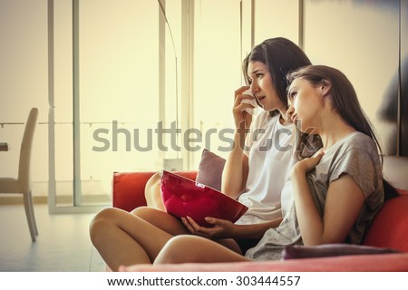 Sad girls watching a movie
