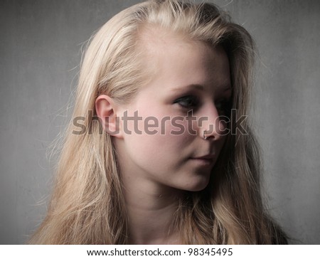 Pretty young woman with a piercing hanging from her nose