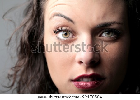 Portrait of a beautiful woman raising an eyebrow