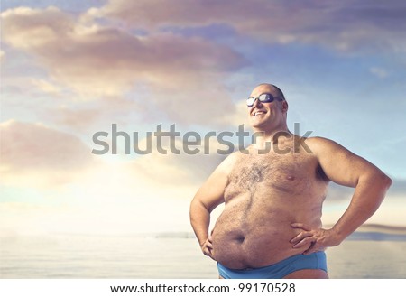 Smiling overweight man in bathing suit
