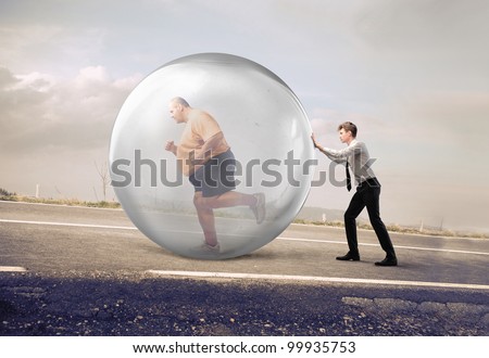 Businessman pushing a bubble with fat man running in it