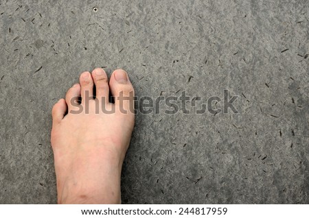Bare Foot on Cement Floor Background. Walk to the Nature. Relax.