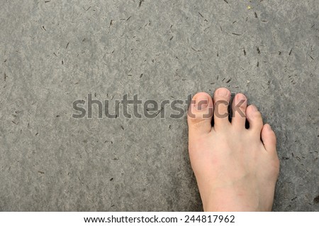 Bare Foot on Cement Floor Background. Walk to the Nature. Relax