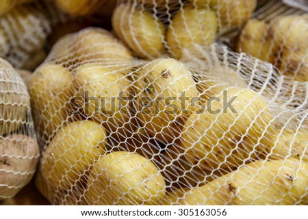 potatoes in the mesh bags at farmers market