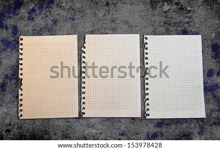 Old paper pages on a grunge background