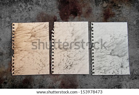 Old paper pages on a grunge background