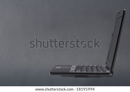 Laptop with path isolated on a black background.