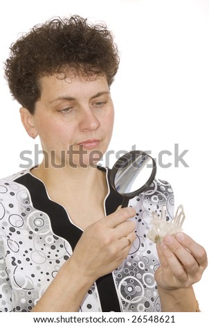 magnifying devices. makeup. models curly woman with magnifying glass