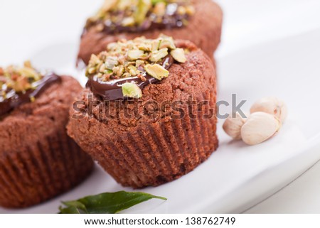 Muffin with milk chocolate and pistachios