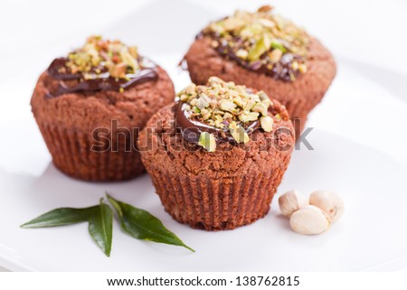 Muffin with milk chocolate and pistachios