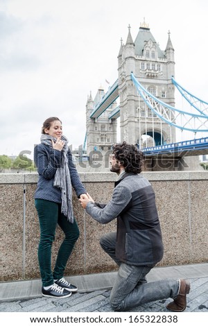 Marriage proposal in front of the Tower Bridge in a winter day, London